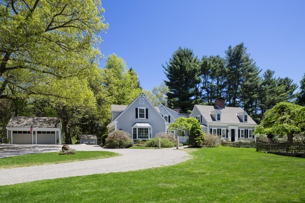 55 Willow Street Dover, MA 02030 - Photo 1 of 22 a front view of a house with a garden