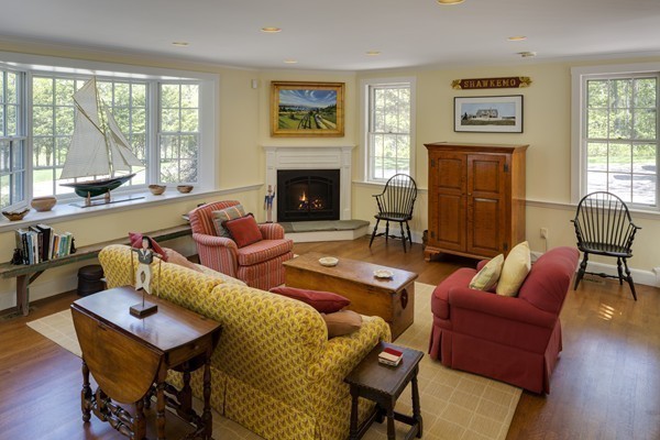 55 Willow Street Dover, MA 02030 - Photo 18 of 22 a living room with furniture fireplace and a large window