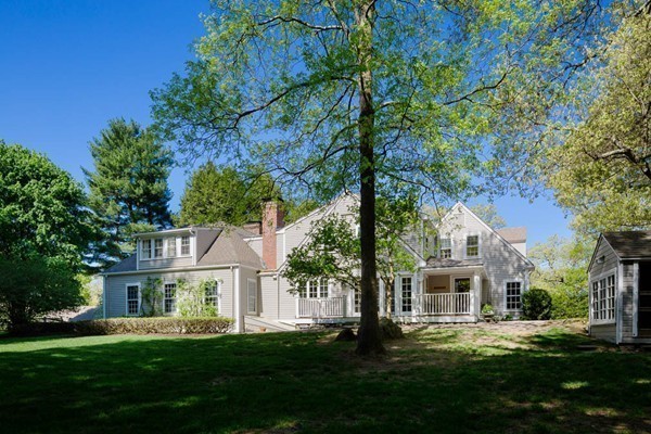 55 Willow Street Dover, MA 02030 - Photo 9 of 22 a front view of a house with a garden