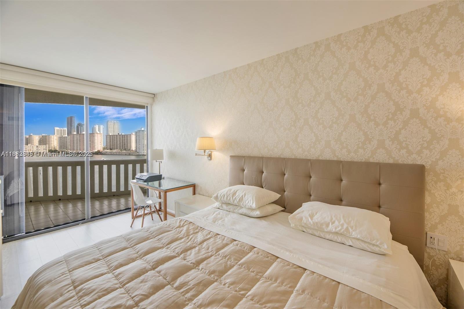 3000 East Island Boulevard, Unit 801 Aventura, FL 33160 - Photo 16 of 36 a bedroom with a bed and a window