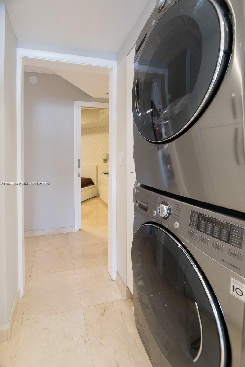 3000 East Island Boulevard, Unit 801 Aventura, FL 33160 - Photo 25 of 36 a utility room with a washer and dryer