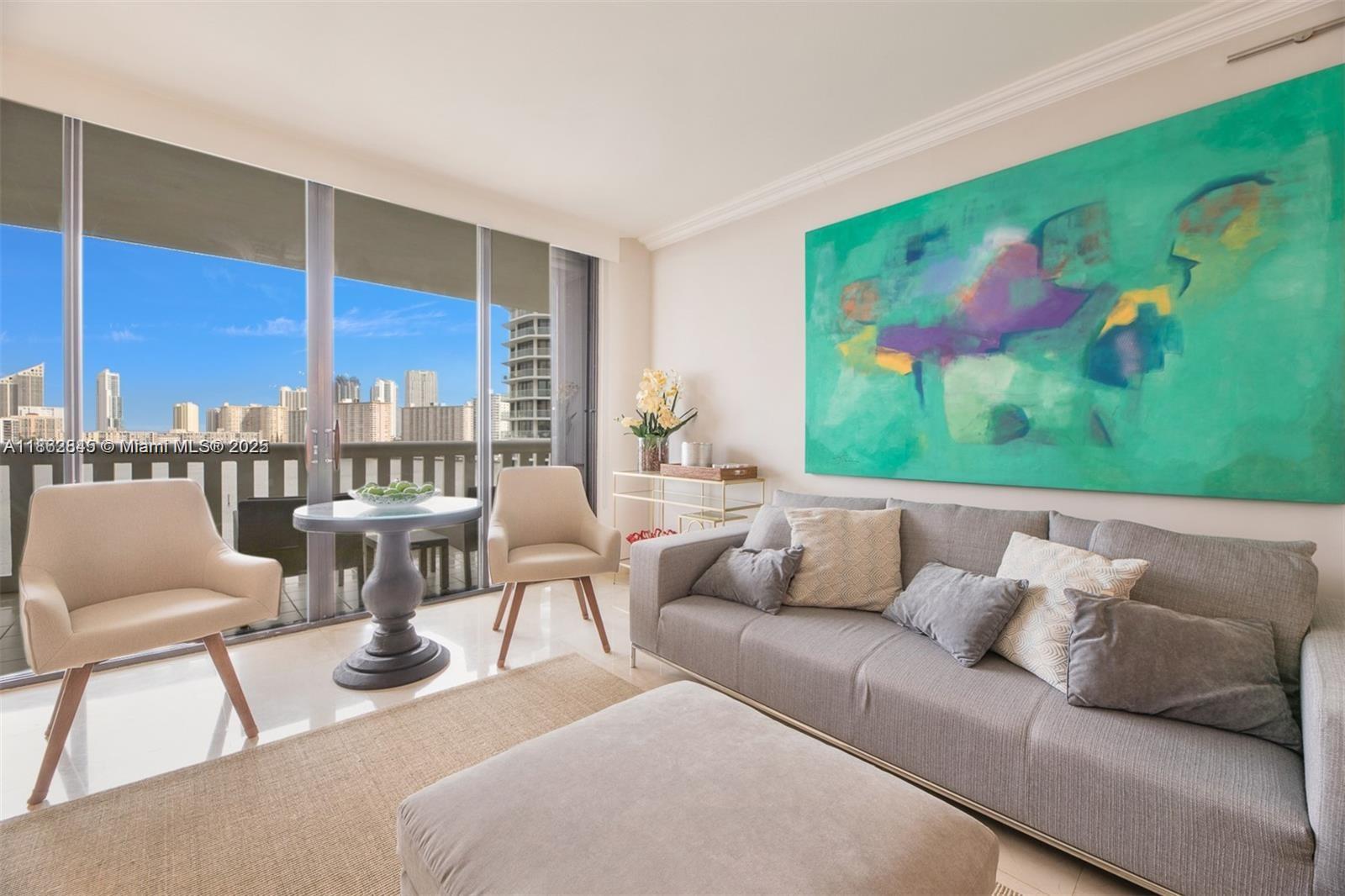 3000 East Island Boulevard, Unit 801 Aventura, FL 33160 - Photo 5 of 36 a living room with furniture city view and large windows