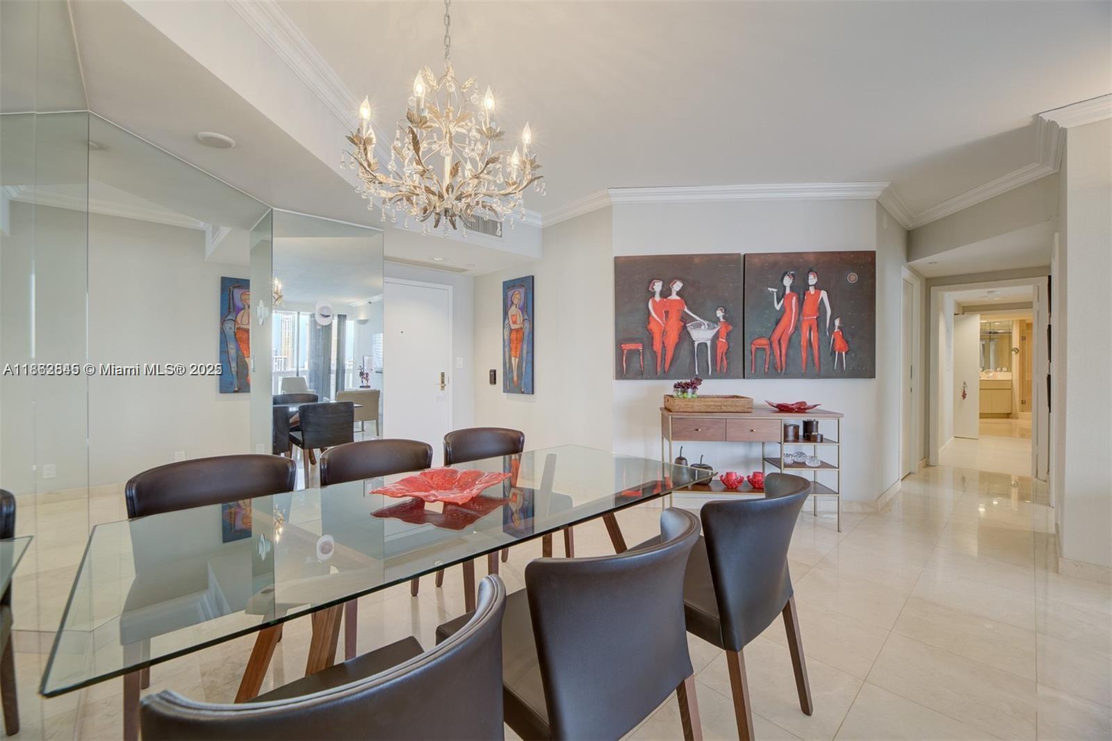 3000 East Island Boulevard, Unit 801 Aventura, FL 33160 - Photo 9 of 36 a view of a dining room with furniture a chandelier and wooden floor