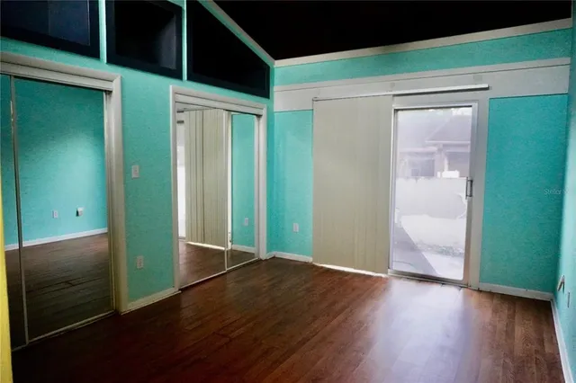 a bathroom with a shower a toilet and a sink