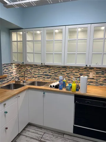 a kitchen with a stove and a microwave