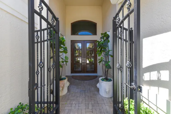 a view of a corridor and potted plants