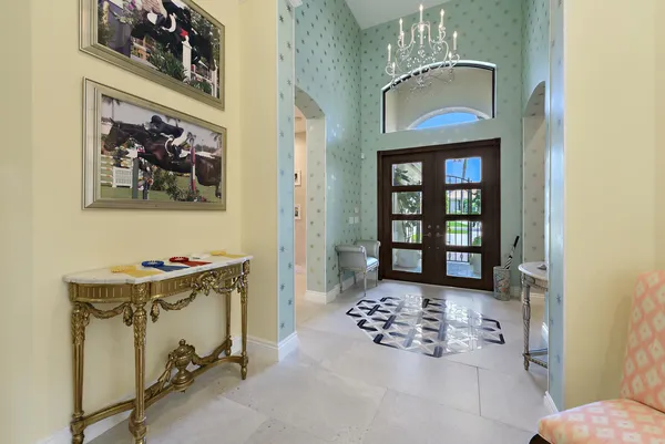 a view of an entryway with wooden floor