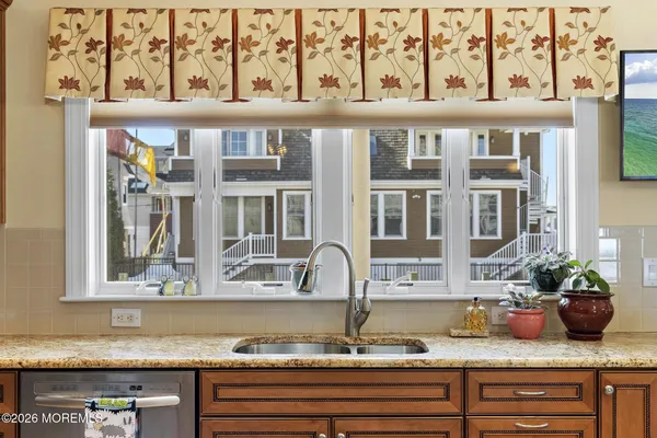 a view of a balcony with wooden floor