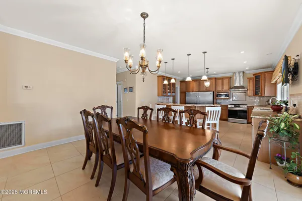 a view of a house with a snow on the road