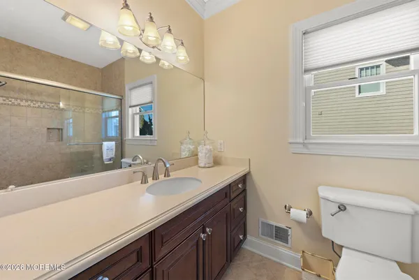 an aerial view of a house with a city view