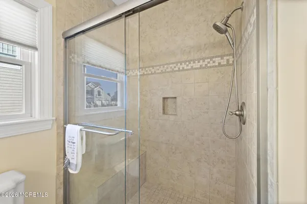 an aerial view of a house with a ocean view