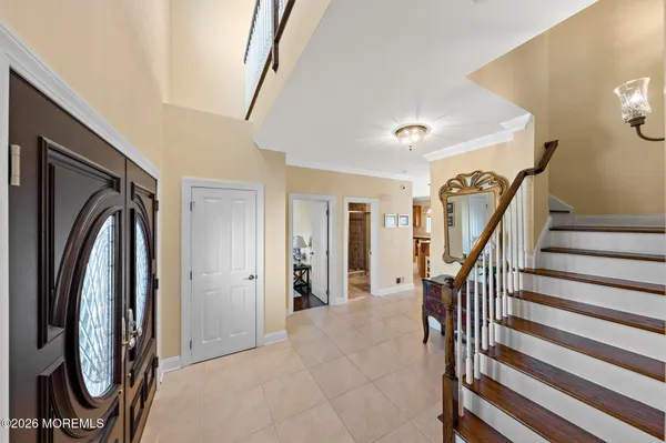 a kitchen with stainless steel appliances granite countertop a stove top oven a sink a counter space and cabinets