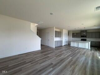 706 Old Station Angier, NC 27501 - Photo 5 of 19 a view of large kitchen with wooden floor and electronic appliances