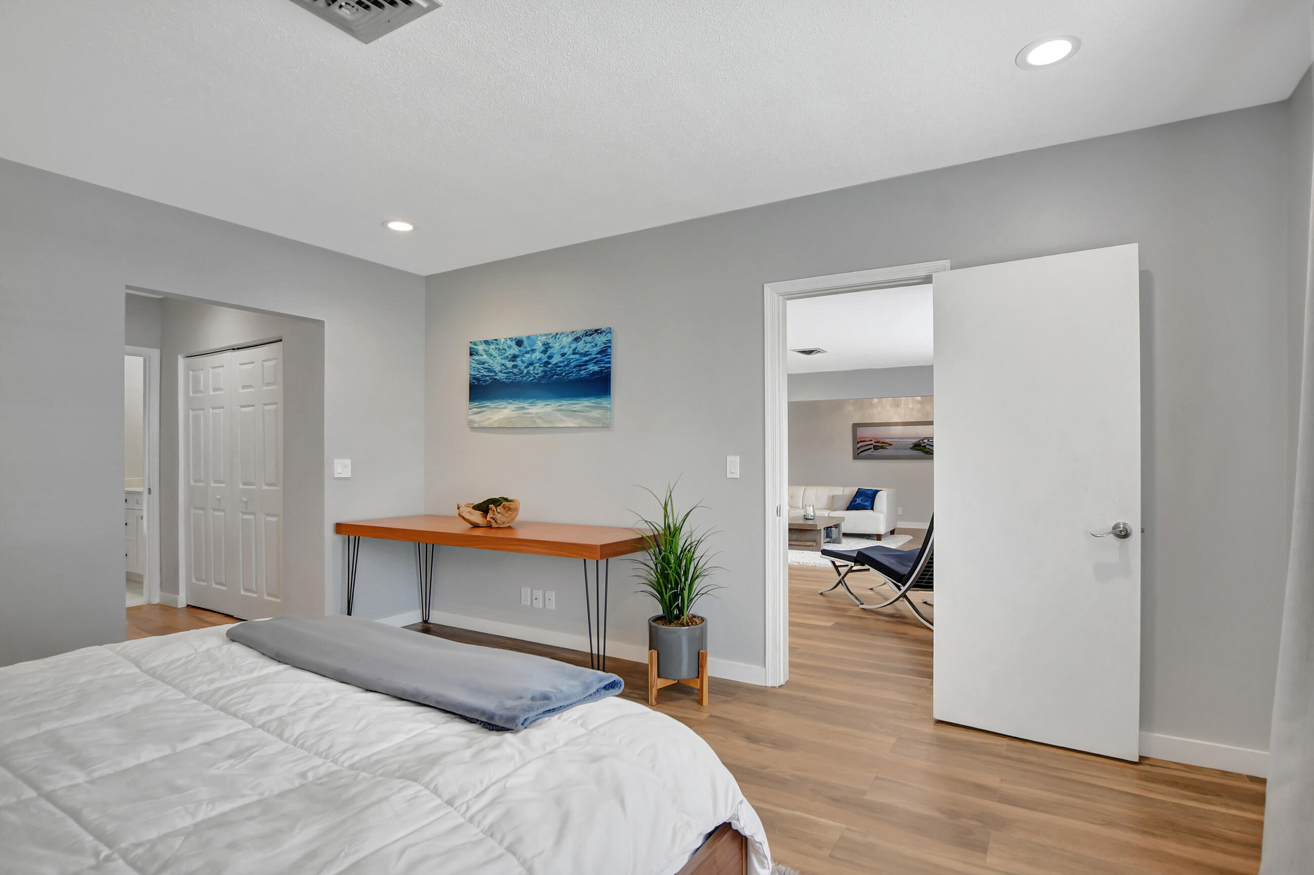510 Silver Lane Boca Raton, FL 33432 - Photo 9 of 24 a bedroom with a bed and a table in it