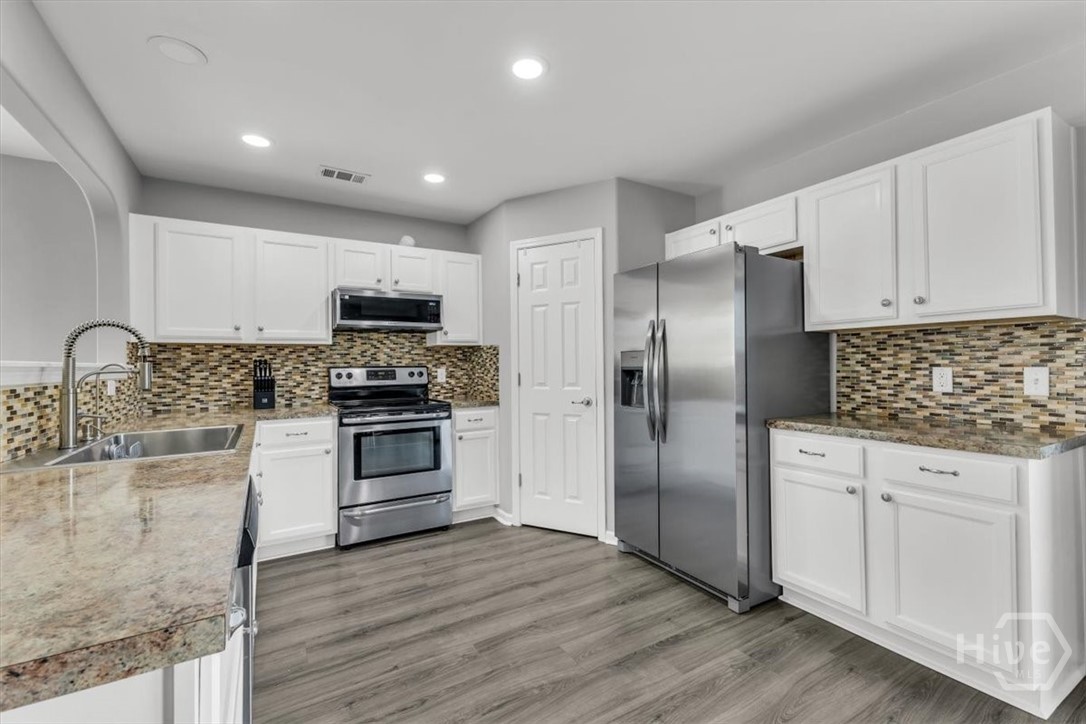 36 Hasty Point Road Port Wentworth, GA 31407 - Photo 18 of 70 KITCHEN VIEW WITH STAINLESS APPLIANCES WITH BACKSPLASH VIEW 1