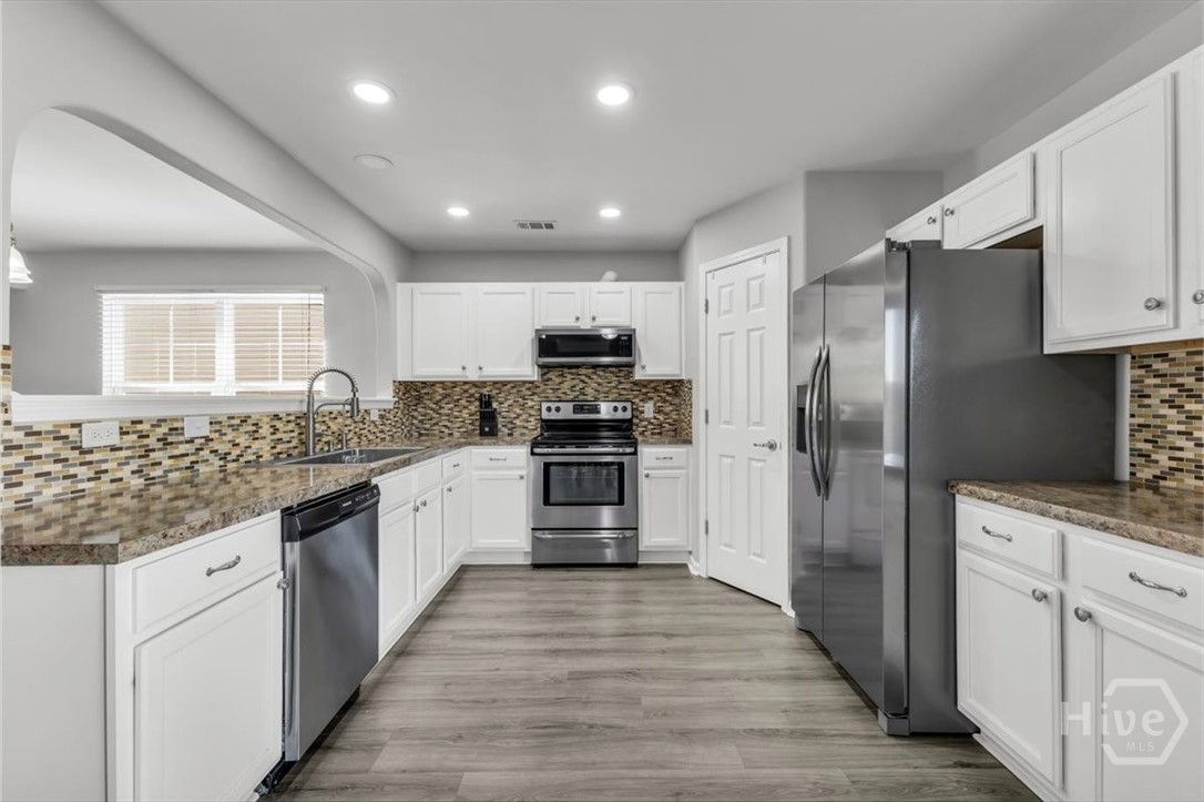 36 Hasty Point Road Port Wentworth, GA 31407 - Photo 20 of 70 KITCHEN VIEW WITH STAINLESS APPLIANCES WITH BACKSPLASH VIEW 3
