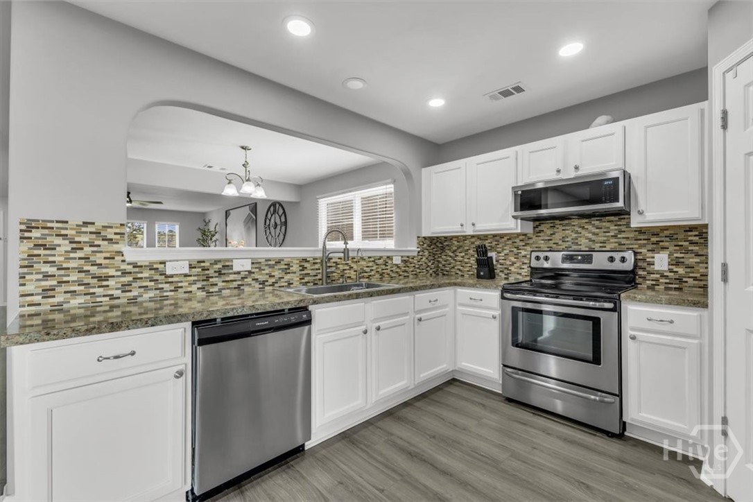 36 Hasty Point Road Port Wentworth, GA 31407 - Photo 21 of 70 KITCHEN VIEW WITH STAINLESS APPLIANCES WITH BACKSPLASH VIEW 4