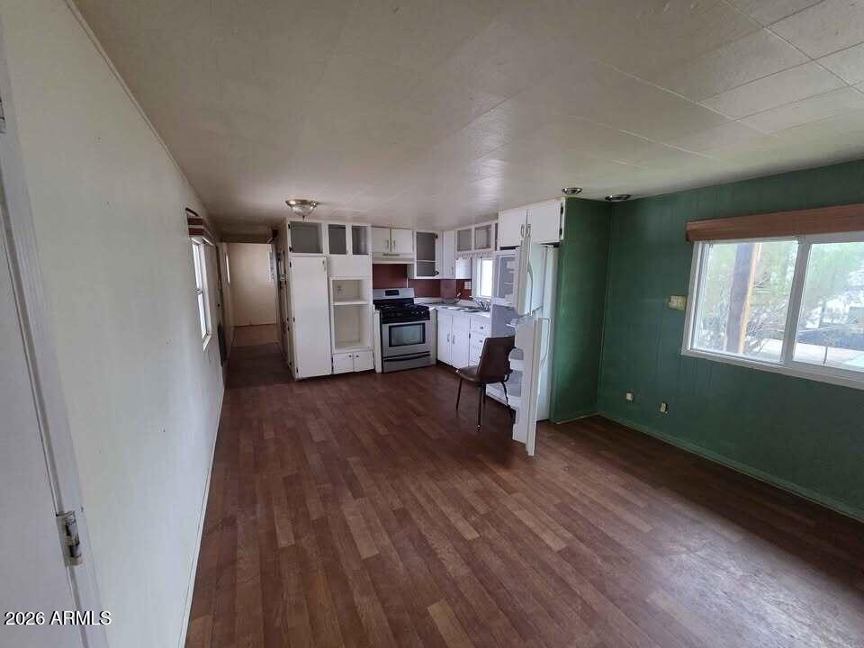 730 Tesota Quartzsite, AZ 85346 - Photo 13 of 15 a room with a window and wooden floor