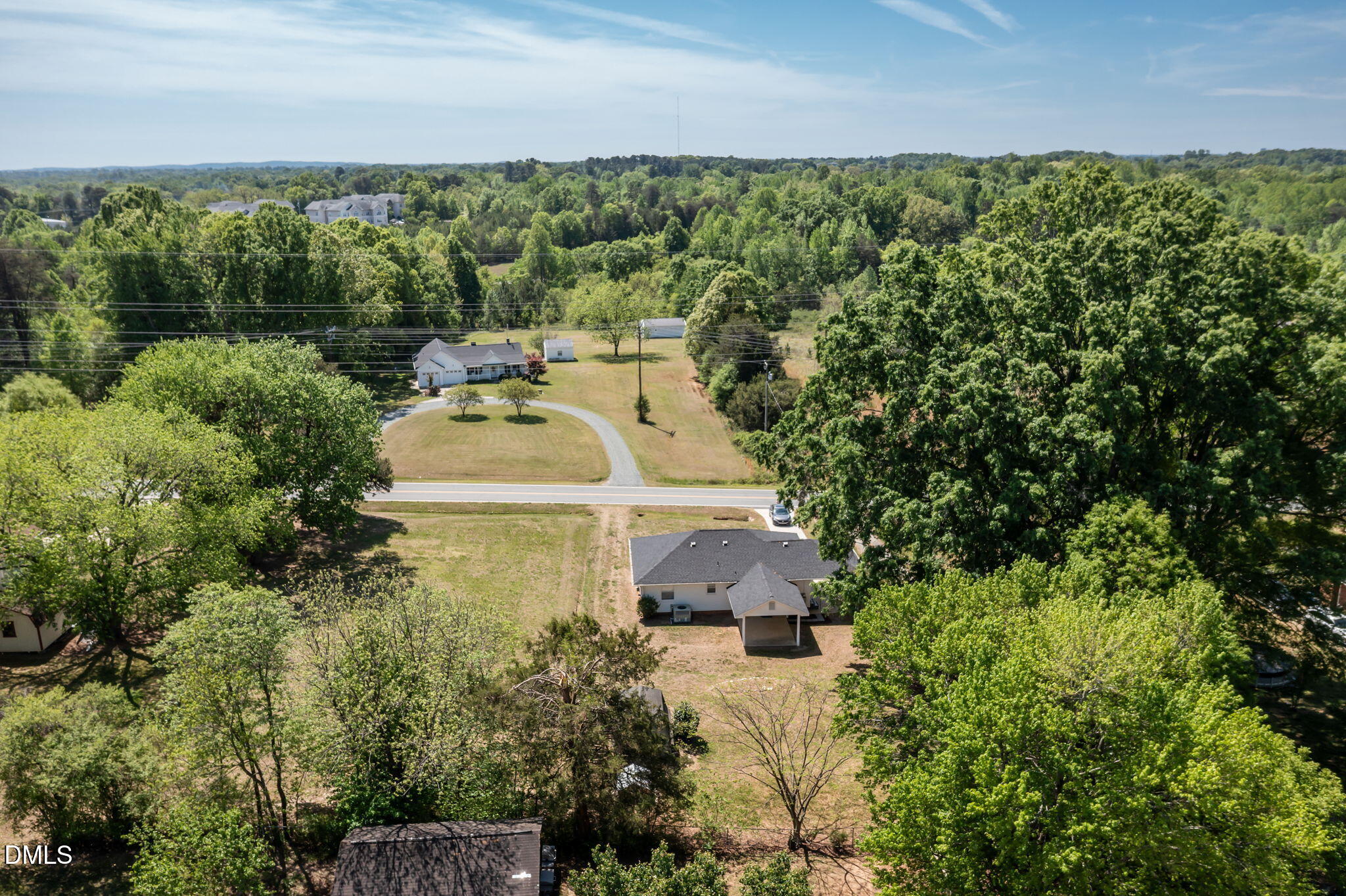 1723 Power Line Road Elon, NC 27244 - Photo 4 of 22 an aerial view of a house with a yard and lake view