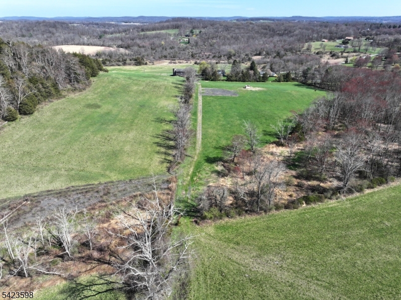 47 Snover Road Lafayette, NJ 07848 - Photo 15 of 33 a view of a grassy field with trees