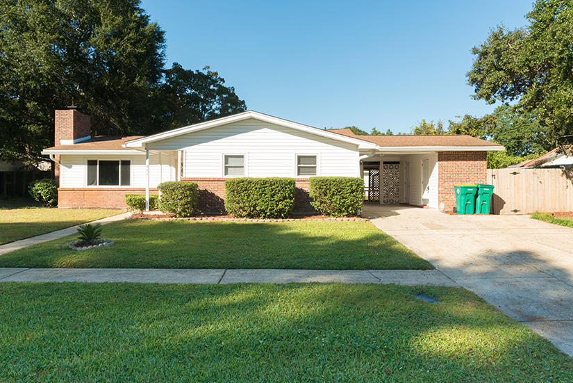 611 Lang Road Fort Walton Beach, FL 32547 - Photo 1 of 26 a front view of a house with a garden