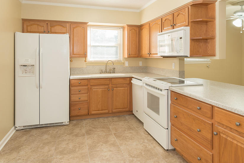 611 Lang Road Fort Walton Beach, FL 32547 - Photo 2 of 26 a kitchen with a stove sink and cabinets