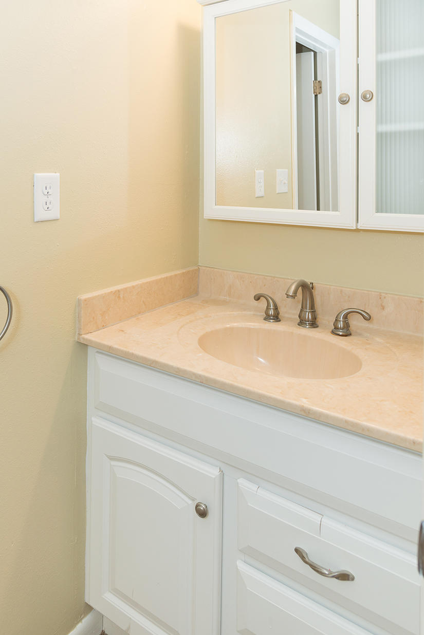 611 Lang Road Fort Walton Beach, FL 32547 - Photo 12 of 26 a bathroom with a sink and a mirror