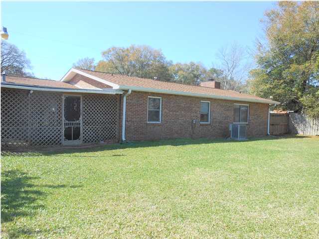 611 Lang Road Fort Walton Beach, FL 32547 - Photo 26 of 26 a backyard of a house with lots of green space