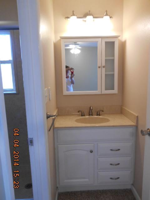 611 Lang Road Fort Walton Beach, FL 32547 - Photo 7 of 26 a bathroom with a granite countertop sink and a mirror