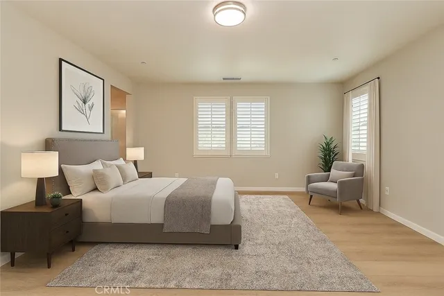 a bedroom with a bed and window