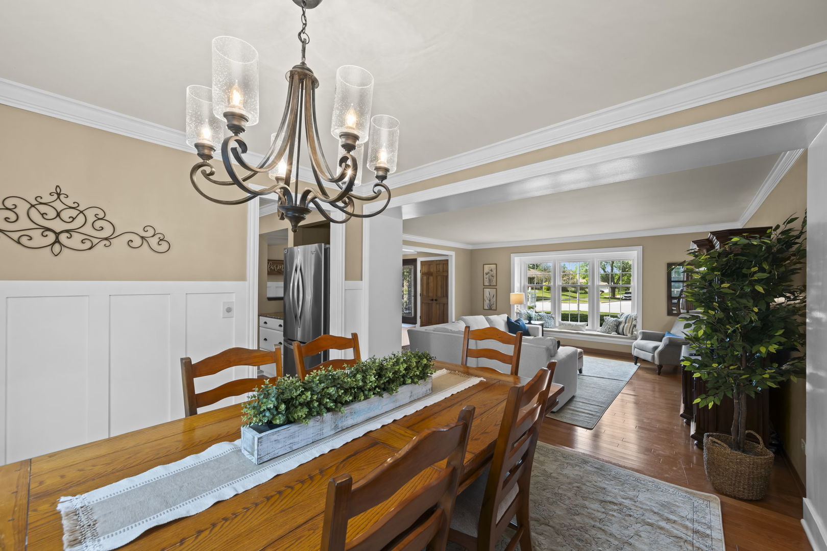 1565 Freeman Road Hoffman Estates, IL 60192 - Photo 16 of 46 a view of a dining room with furniture window and wooden floor