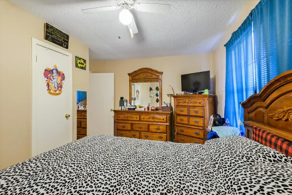 a bedroom with a bed and furniture