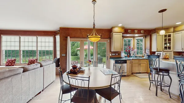 a view of a dining room with furniture window and outside view