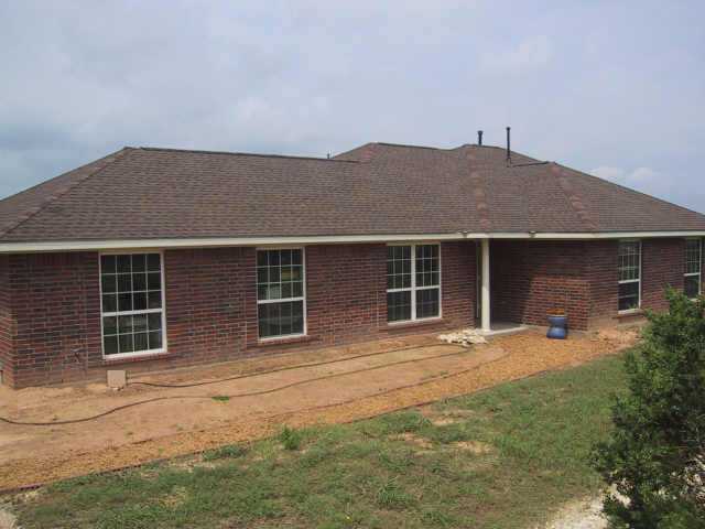 811 Old Red Ranch Road Dripping Springs, TX 78620 - Photo 1 of 1 front view of house with a yard