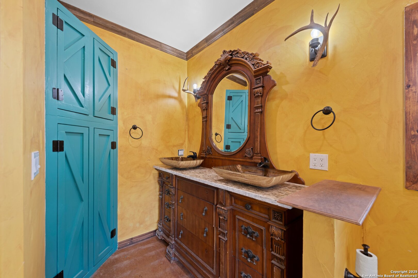 1065 B & R Utopia, TX 78884 - Photo 23 of 28 a bathroom with a sink and a mirror