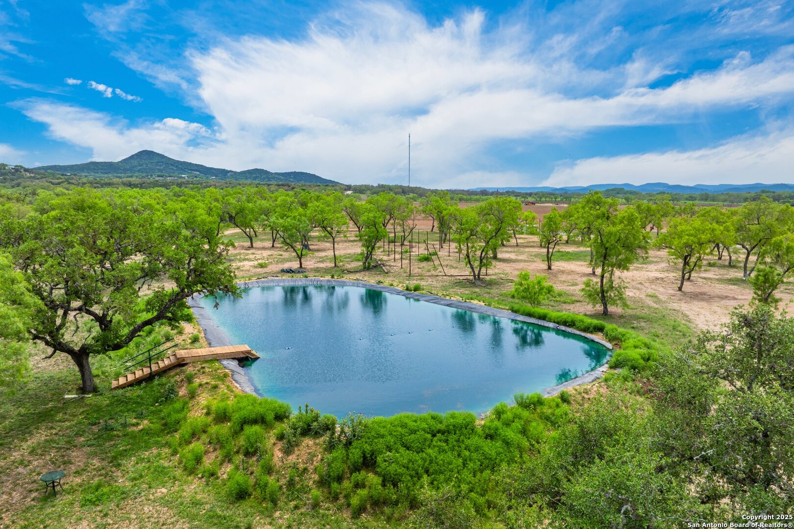 1065 B & R Utopia, TX 78884 - Photo 6 of 28 a view of a lake with a big yard