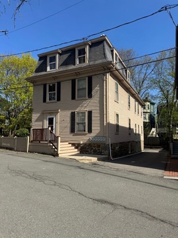 15 Harris Street, Unit 2 Marblehead, MA 01945 - Photo 1 of 12 a view of a house with a yard