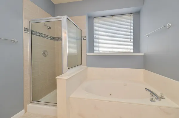 a white bath tub sitting in a bathroom