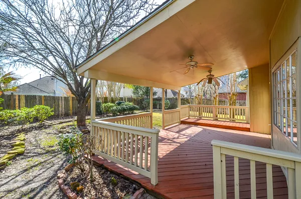 a view of a house with backyard and porch