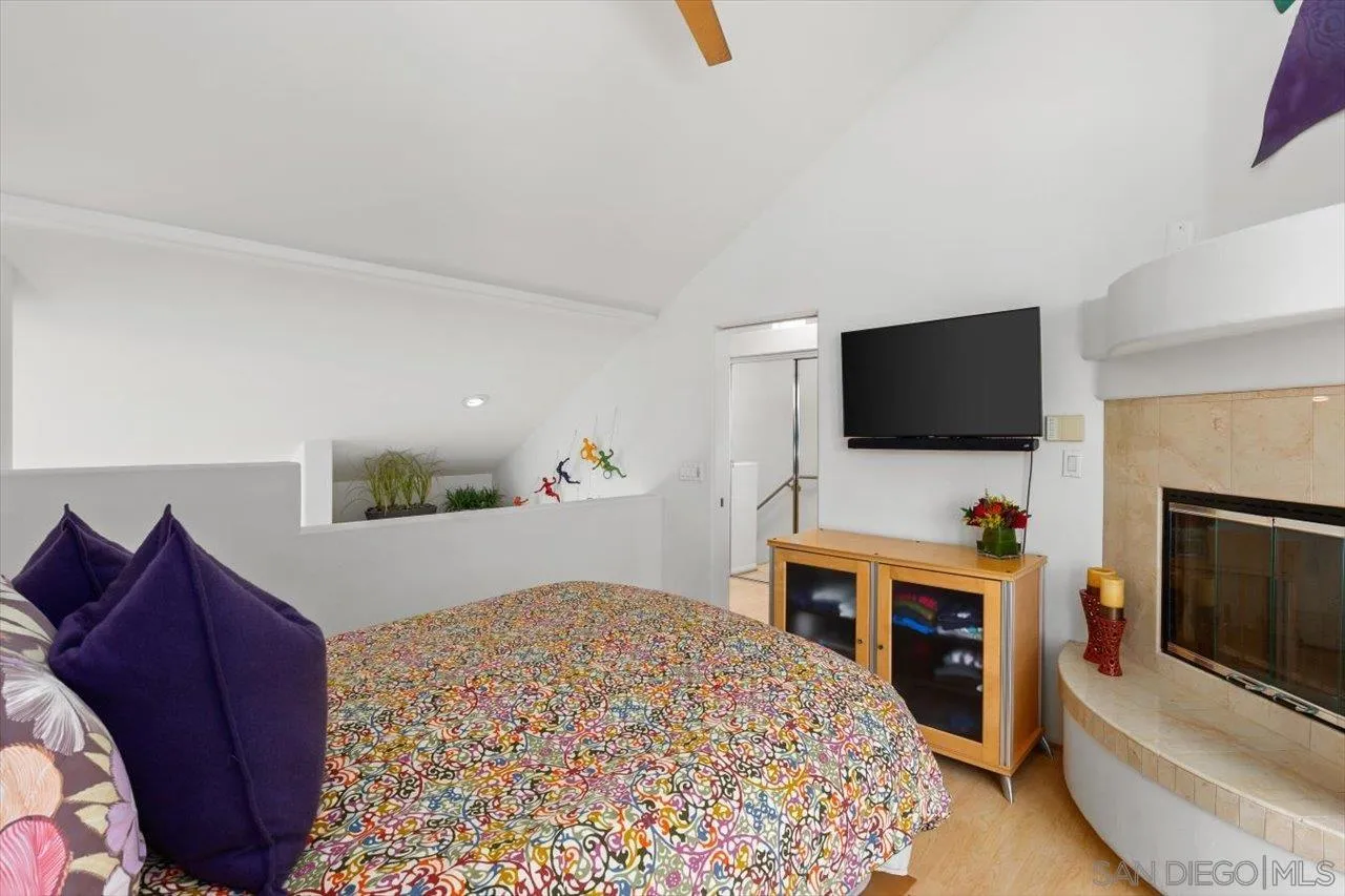 155 Sherrie Lane Del Mar, CA 92014 - Photo 12 of 38 a bedroom with a bed and a flat screen tv