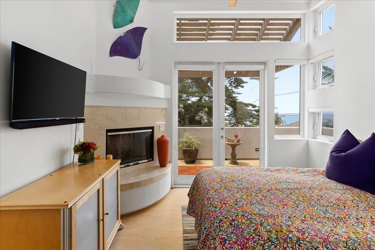 155 Sherrie Lane Del Mar, CA 92014 - Photo 13 of 38 a bedroom with a bed and a flat screen tv