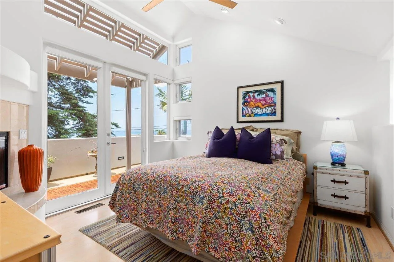 155 Sherrie Lane Del Mar, CA 92014 - Photo 14 of 38 a bedroom with a bed and wooden floor