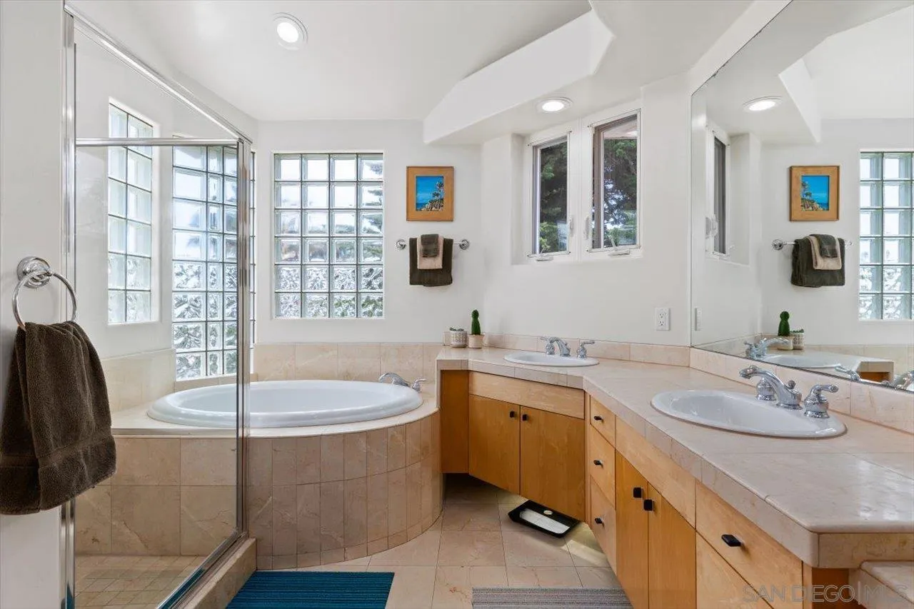 155 Sherrie Lane Del Mar, CA 92014 - Photo 15 of 38 a bathroom with a tub sink and mirror