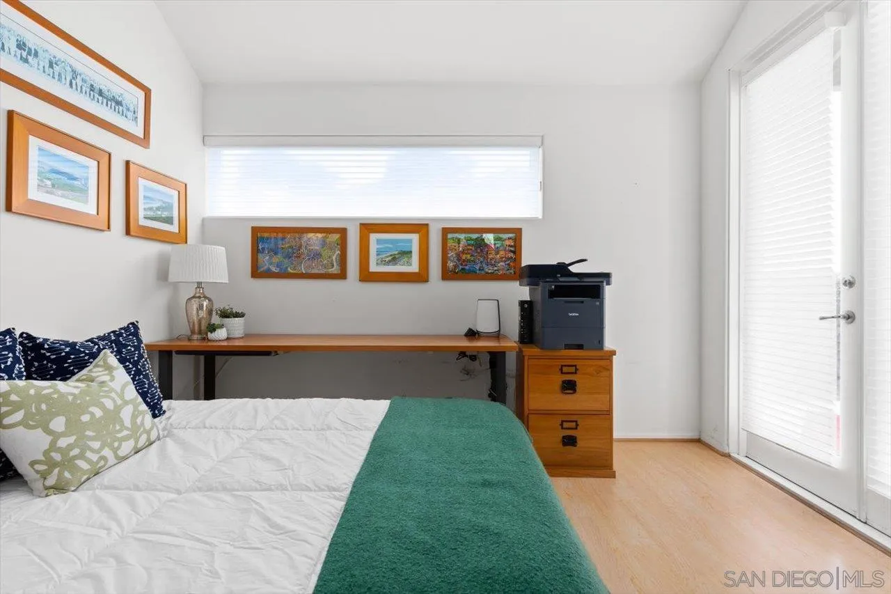 155 Sherrie Lane Del Mar, CA 92014 - Photo 18 of 38 a bedroom with a bed and wooden floor