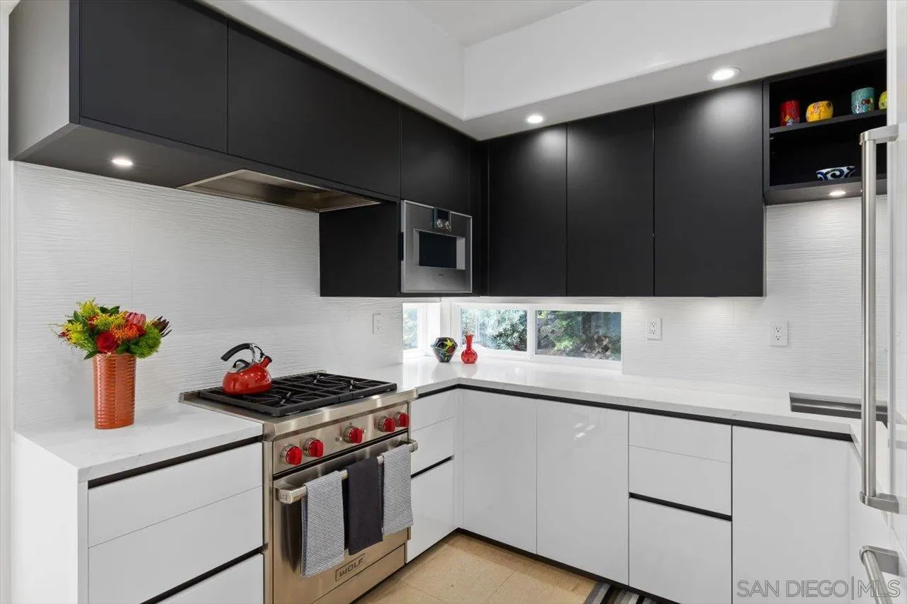 155 Sherrie Lane Del Mar, CA 92014 - Photo 23 of 38 a kitchen with a sink and cabinets