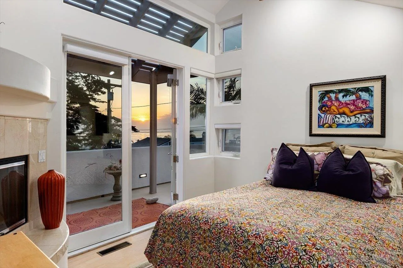 155 Sherrie Lane Del Mar, CA 92014 - Photo 6 of 38 a large bedroom with bed and glass door