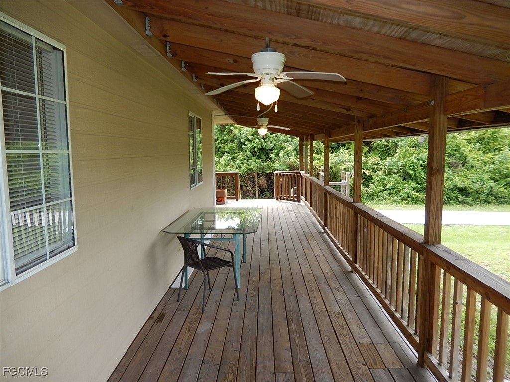 3309 2nd Street Southwest Lehigh Acres, FL 33976 - Photo 15 of 17 a view of a balcony with furniture and wooden floor