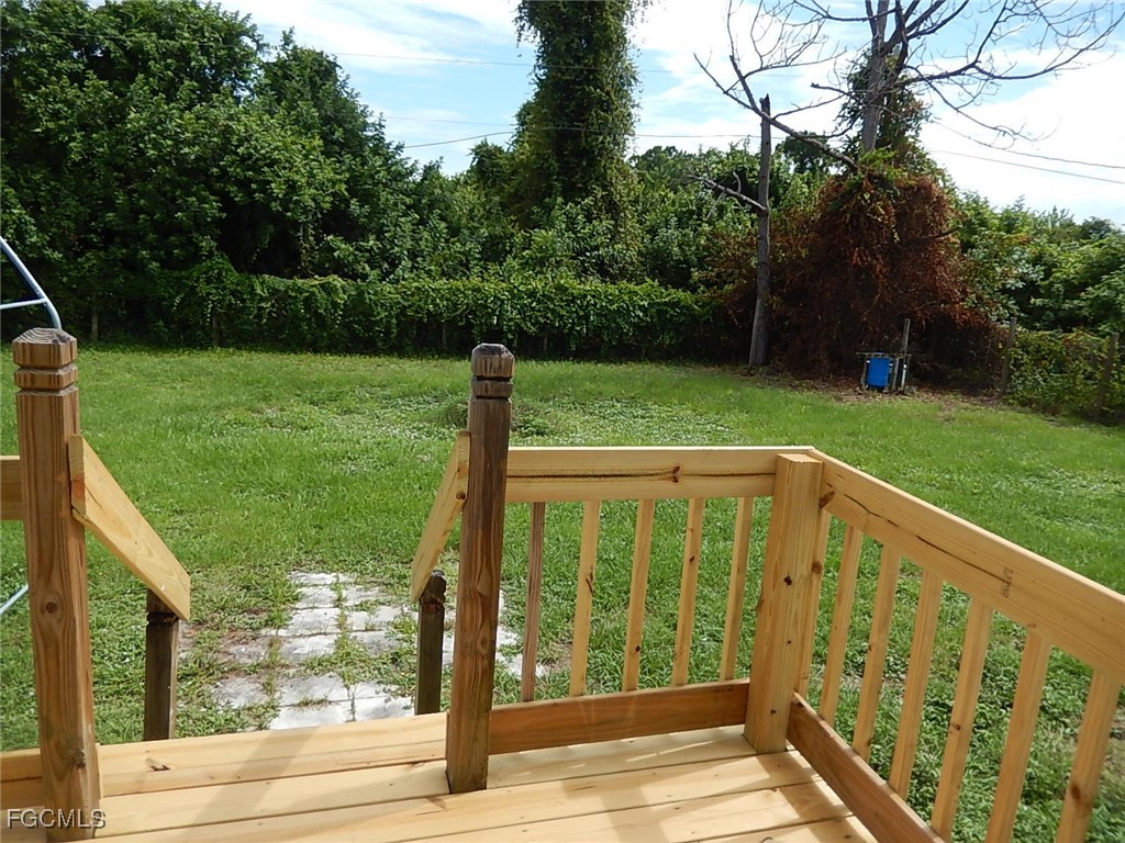 3309 2nd Street Southwest Lehigh Acres, FL 33976 - Photo 17 of 17 a view of a porch and garden
