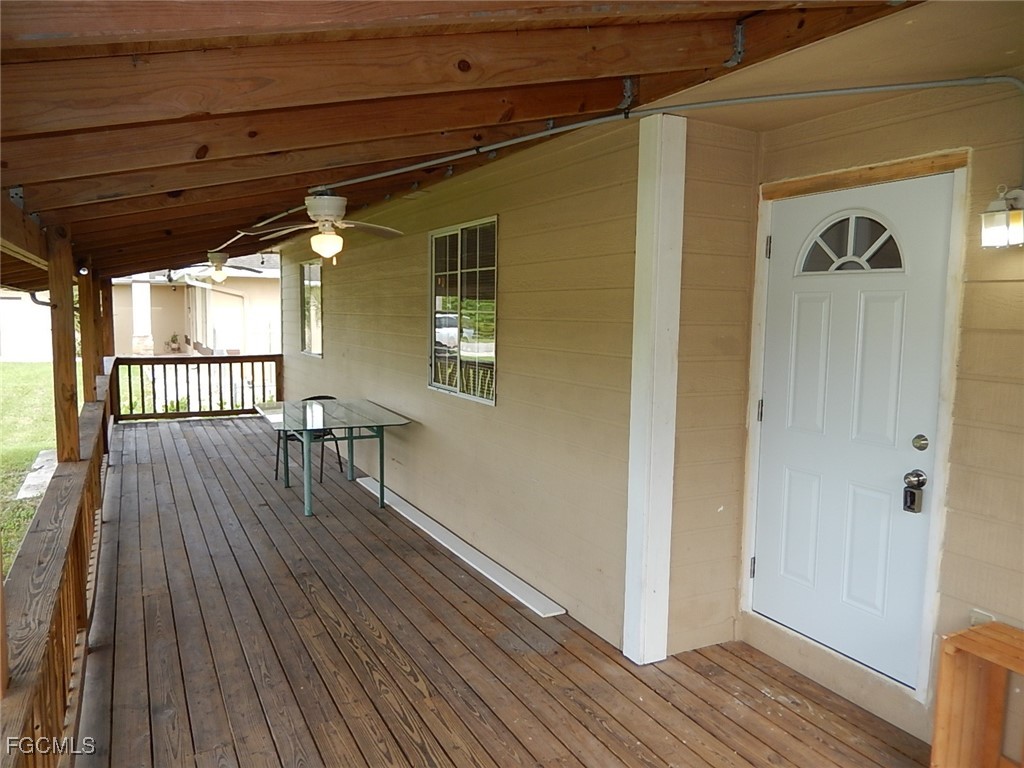 3309 2nd Street Southwest Lehigh Acres, FL 33976 - Photo 2 of 17 a view of a house with wooden floor