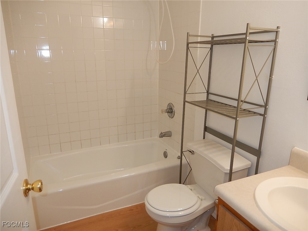 3309 2nd Street Southwest Lehigh Acres, FL 33976 - Photo 9 of 17 a bathroom with a toilet and a shower